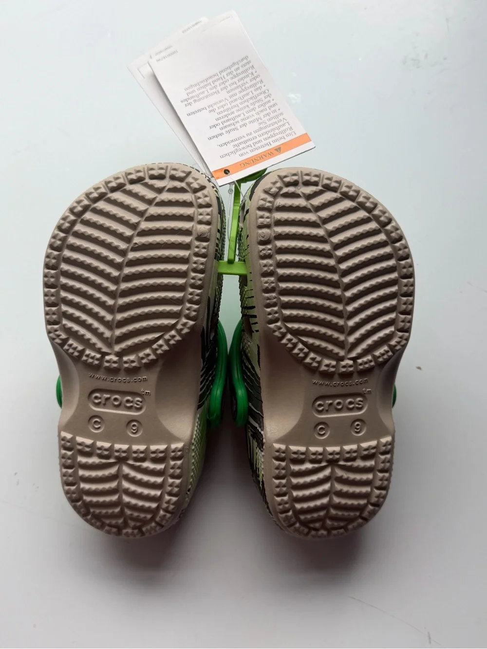 CROCS Kids Green Tropical Print Clogs with Lime Strap